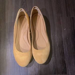 Mustard yellow flats. Worn once.